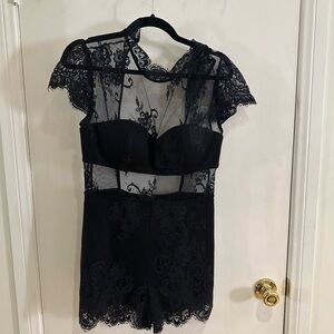 BEBE black lace romper/jumpsuit. Brand new with tags.